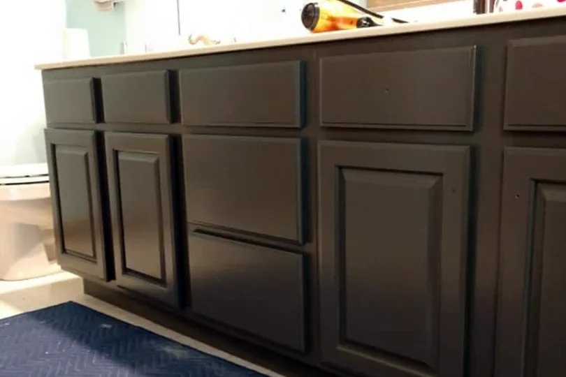 Vanity cabinets painted deep charcoal by Full Spectrum Painting