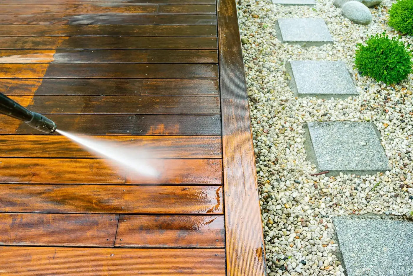 Deck being washed and stained, before and after